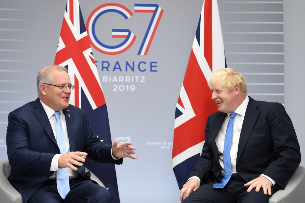 Britain's Prime Minister Boris Johnson (R) meets Australian Prime Minister Scott Morrison (L) for bilateral talks during the G7 summit in Biarritz, France, on Monday. — Reuters