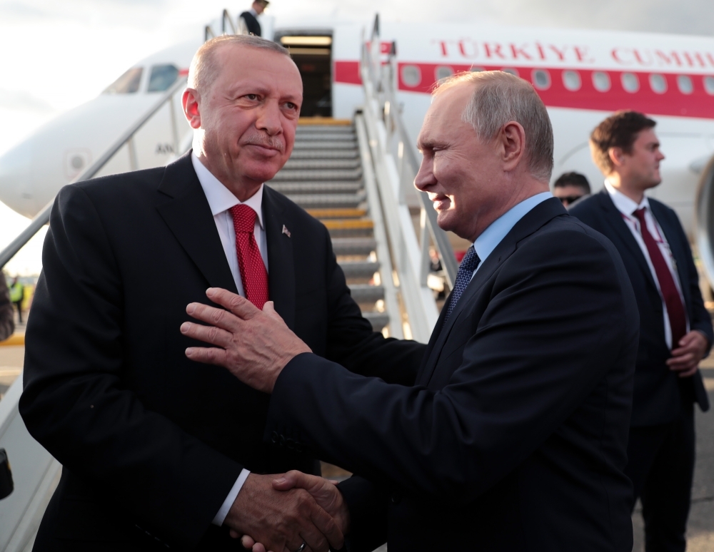 Russian President Vladimir Putin, right, welcomes his Turkish counterpart Recep Tayyip Erdogan during his visit to Moscow on Tuesday. — AFP