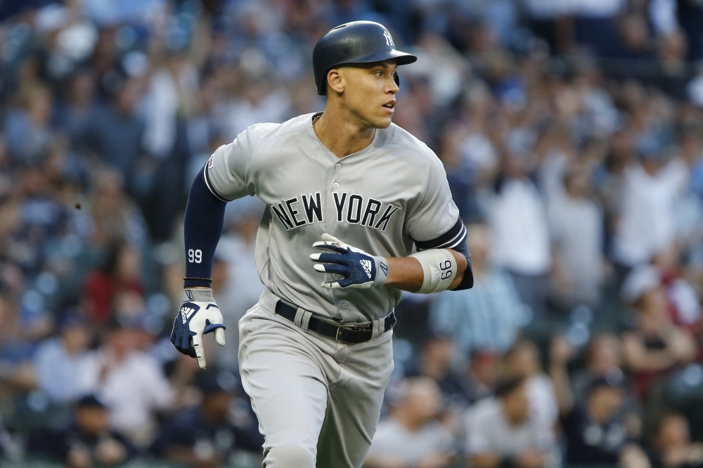 Aaron Judge No. 99 of the New York Yankees jogs the bases after hitting his 100th career home run in the first inning against the Seattle Mariners at T-Mobile Park on Tuesday in Seattle, Washington.  — AFP