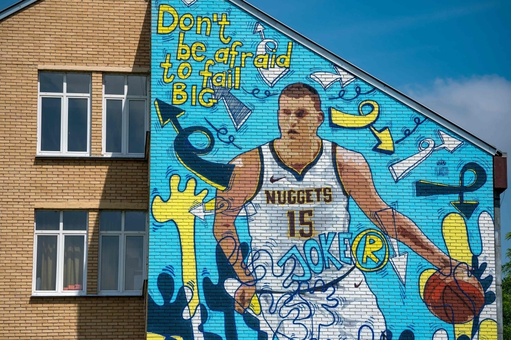 This photo shows a mural depicting Nikola Jokic, the 24-year-old Serbian basketball player who plays for the NBA's Denver Nuggets, painted on a wall of his former school in his hometown of Sombor. Serbs are hoping that their homegrown hero Jokic — who did not play in the 2014 World Cup — can fire the country at the latest edition, which starts on Aug. 31 in China. — AFP