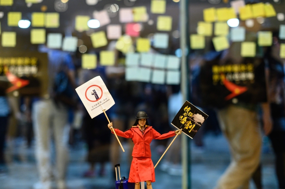 A flight attendant doll is placed inside a shopping mall during a rally to support Cathay Pacific staff in Hong Kong on Wednesday. — AFP