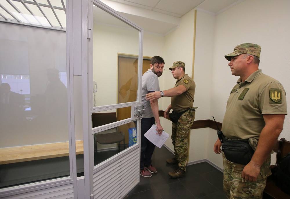 Kirill Vyshinsky, director of the Ukrainian office of the Russian state news agency RIA Novosti, who was detained by Security Service of Ukraine on treason charges in 2018, leaves a defendants cage after a court ordered his release on bail, in Kiev, Ukraine, on Wednesday. — Reuters