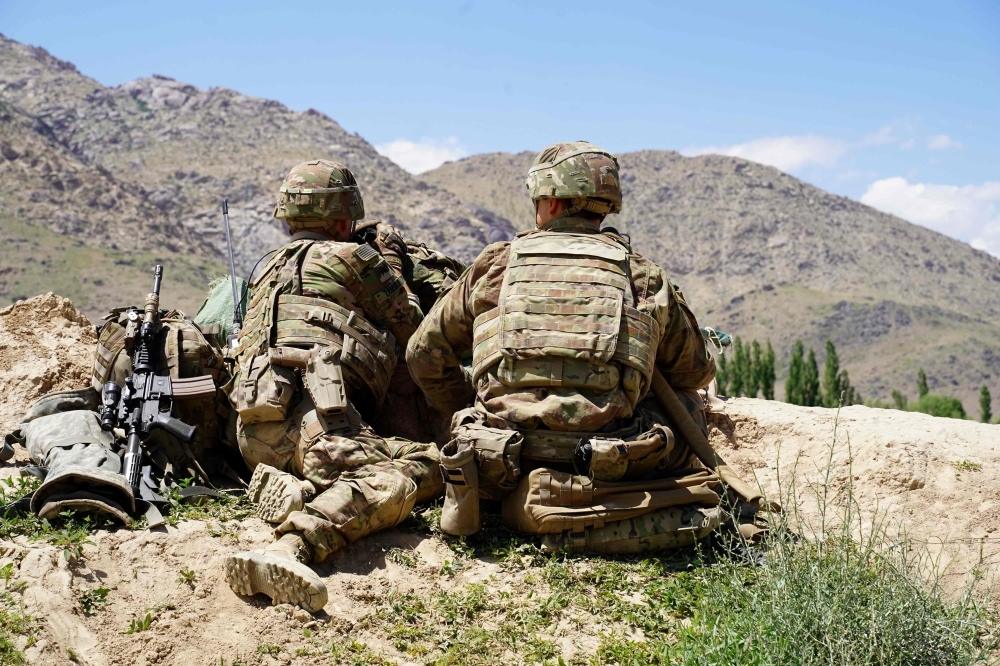 US soldiers look out over hillsides during a visit of the commander of US and NATO forces in Afghanistan at the Afghan National Army (ANA) checkpoint in Nerkh district of Wardak province in this June 6, 2019 file photo. — AFP