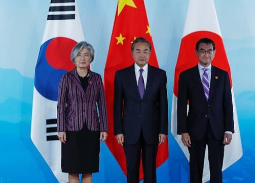 
File photo: Chinese FM Wang Yi, South Korean FM Kang Kyung-wha and Japanese FM Taro Kono pose for photo
