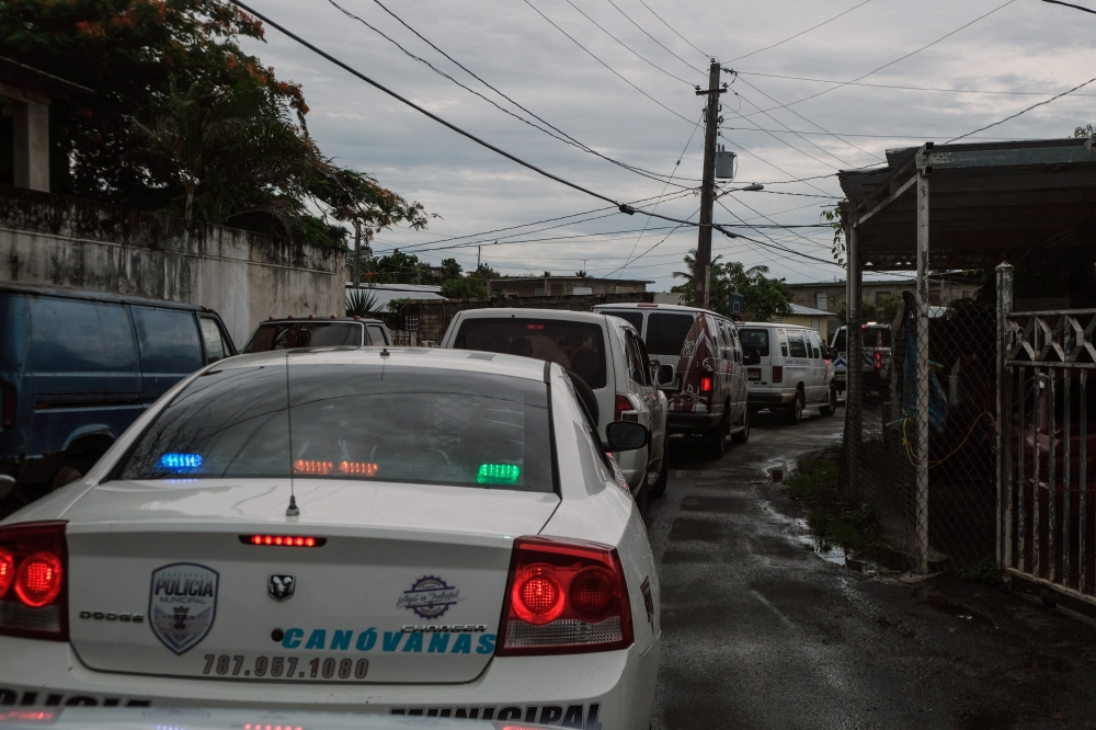 The emergency management crews of Canovanas visit communities identified as high flood risk as Hurricane Dorian approaches the northeast of Puerto Rico on Wednesday. — Reuters