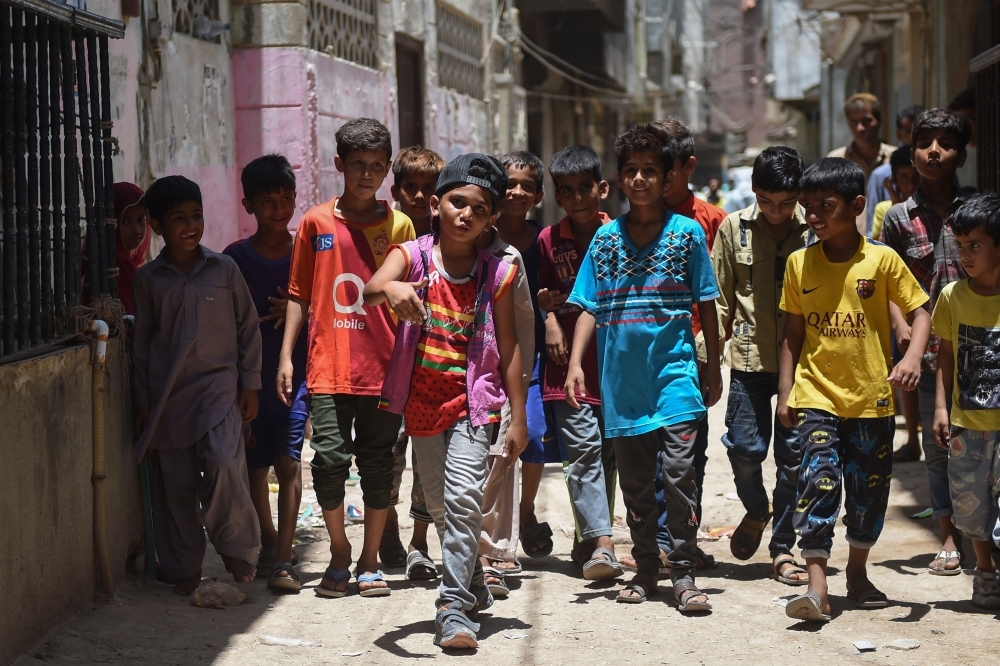 Eight-year-old rapper Waqas Baloch, center, performs in Lyari, one of Pakistan’s most dangerous neighborhoods, in Karachi, in this May 19, 2019 file photo. — AFP