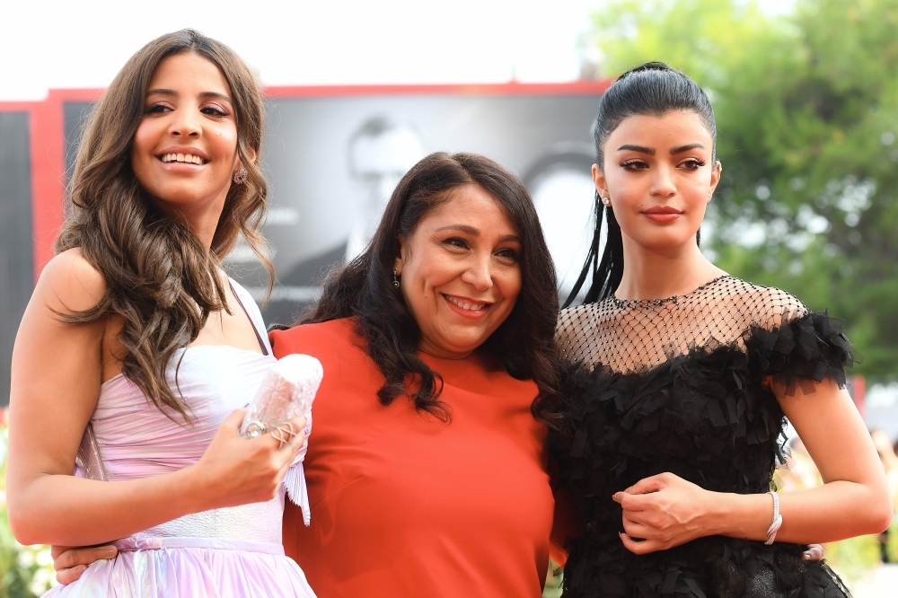 (From L) Saudi actress Dhay, Saudi director Haifaa Al-Mansour and Saudi actress Mila Al Zahrani arrive on THursday for the screening of the film 