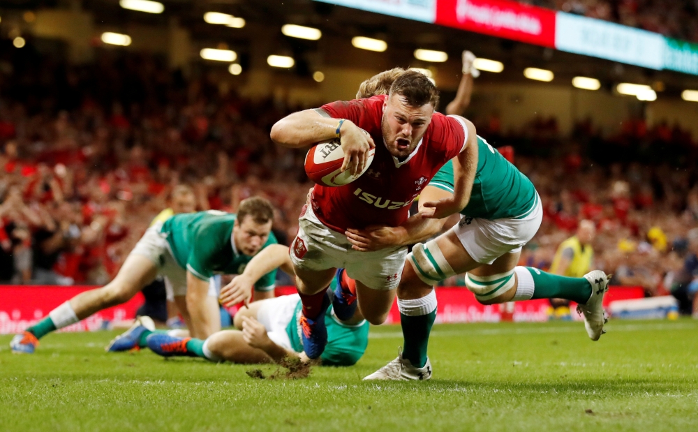 Wales' Owen Lane scores their first try  during the Rugby World Cup warm-up match against Ireland at the Principality Stadium, Cardiff, Britain, on Saturday. — Reuters