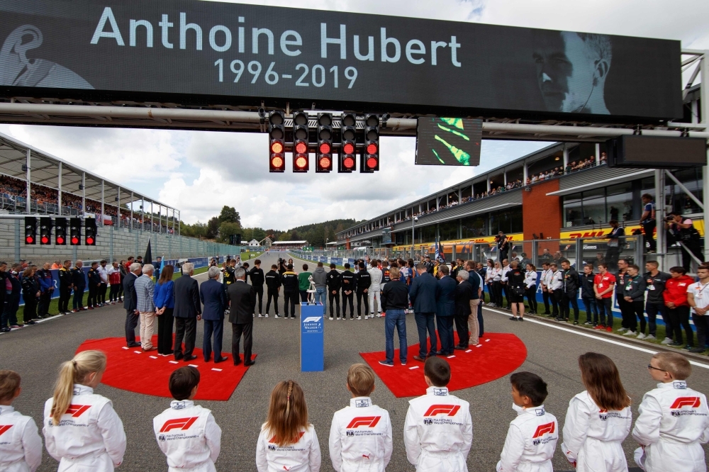 Drivers and team members observe a minute's silence for late BWT Arden's French driver Anthoine Hubert, who died in an accident during a Formula 2 race on Saturday, before the start of the Belgian Formula One Grand Prix at the Spa-Francorchamps circuit in Spa on Sunday. — AFP
