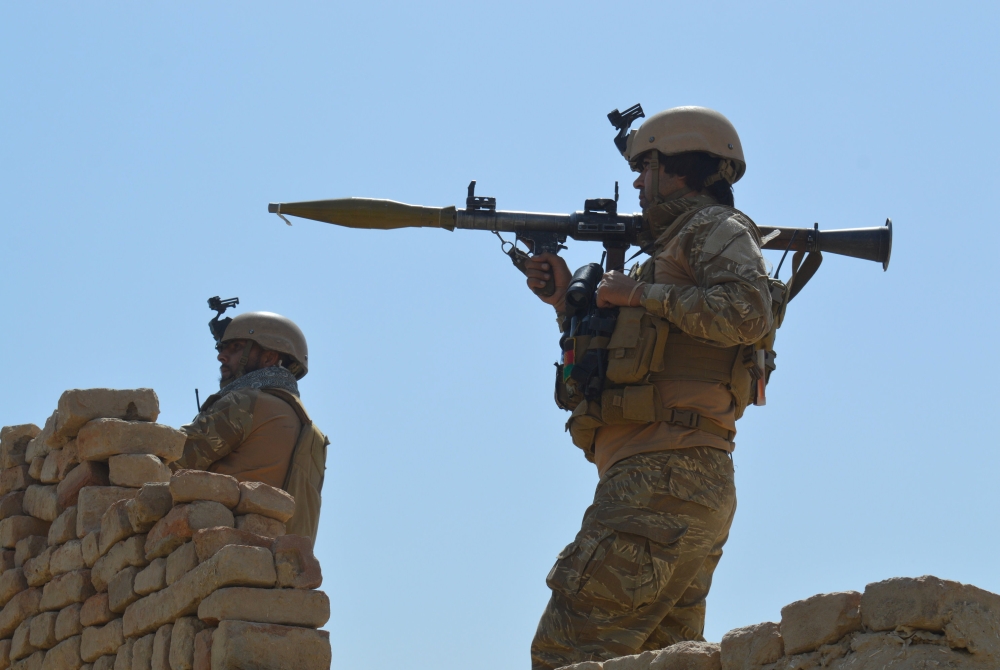 Afghan security forces take position during a battle with the Taliban in Kunduz province, Afghanistan Sunday. — Reuters