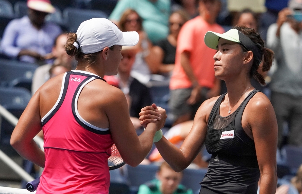 Qiang Wang of China (R) shakes hands after defeating Ashleigh Barty of Australia during their Round 4 women's Singles match at the 2019 US Open at the USTA Billie Jean King National Tennis Center in New York on Sunday. — AFP 