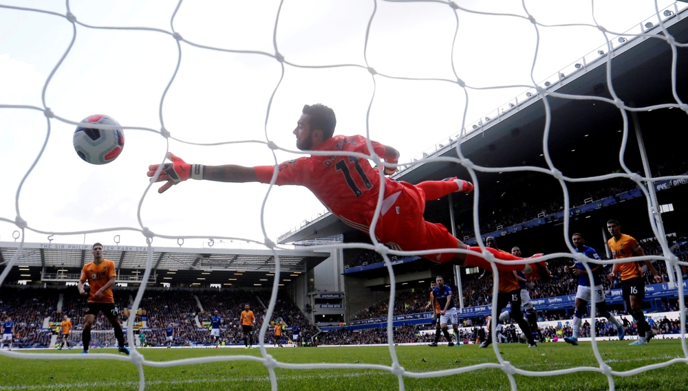 Everton's Richarlison scores their third goal during their English Premier League match against Wolverhampton Wanderers at Goodison Park, Liverpool, Britain, on Sunday. — Reuters