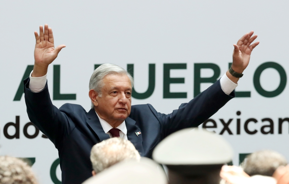 Mexico's President Andres Manuel Lopez Obrador waves after delivering his first state of the union at National Palace in Mexico City, Mexico, on Sunday. -Reuters