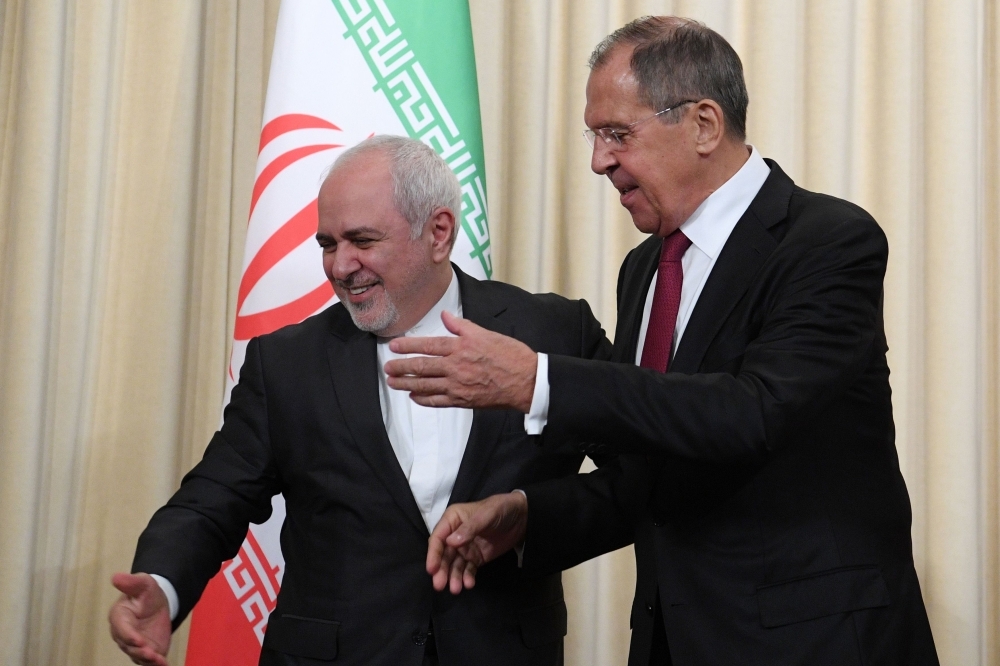 Russian Foreign Minister Sergei Lavrov, right, and his Iranian counterpart Mohammad Javad Zarif attend a meeting in Moscow on Monday. — AFP