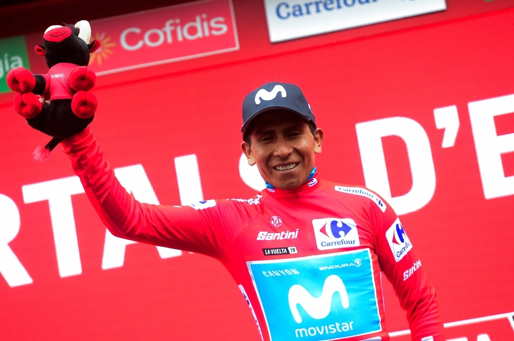 Team Movistar rider Colombia's Nairo Quintana, wearing the leader´s red jersey, celebrates on the podium after  the ninth stage of the 2019 La Vuelta cycling tour of Spain, a 94,4 km race from Andorra la Vella to Cortals d'Encamp on Sunday in Els Cortals. — AFP
