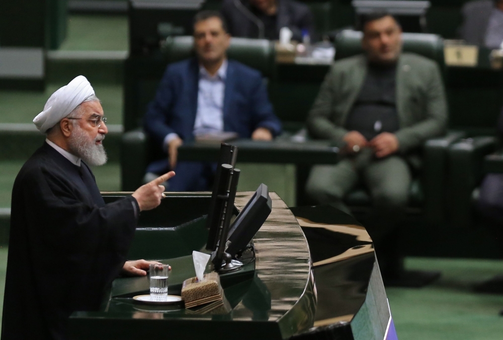 Iran's President Hassan Rouhani, left, addresses parliament in the capital Tehran on Tuesday. — AFP