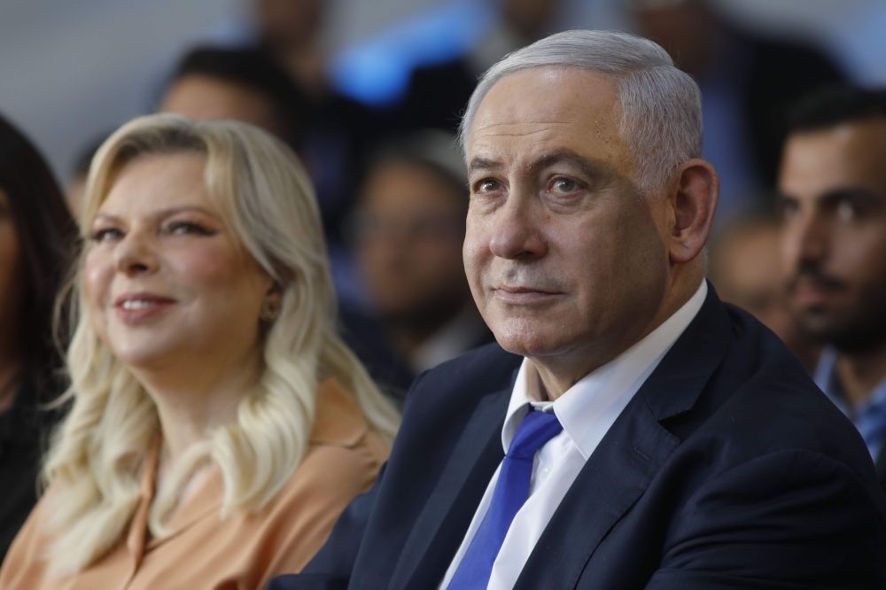 Israeli Prime Minister Benjamin Netanyahu and his wife Sara visit the West Bank town of Hebron on Wednesday. — AFP