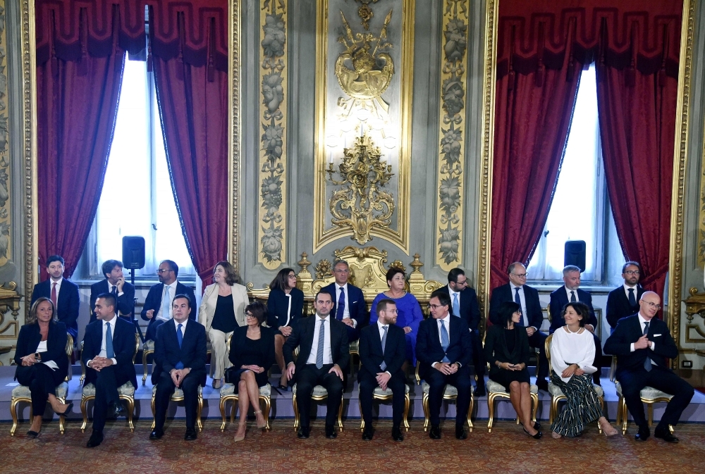 Members of Italy's new Cabinet attend a swearing-in ceremony at the Quirinale presidential palace in Rome on Thursday. — AFP