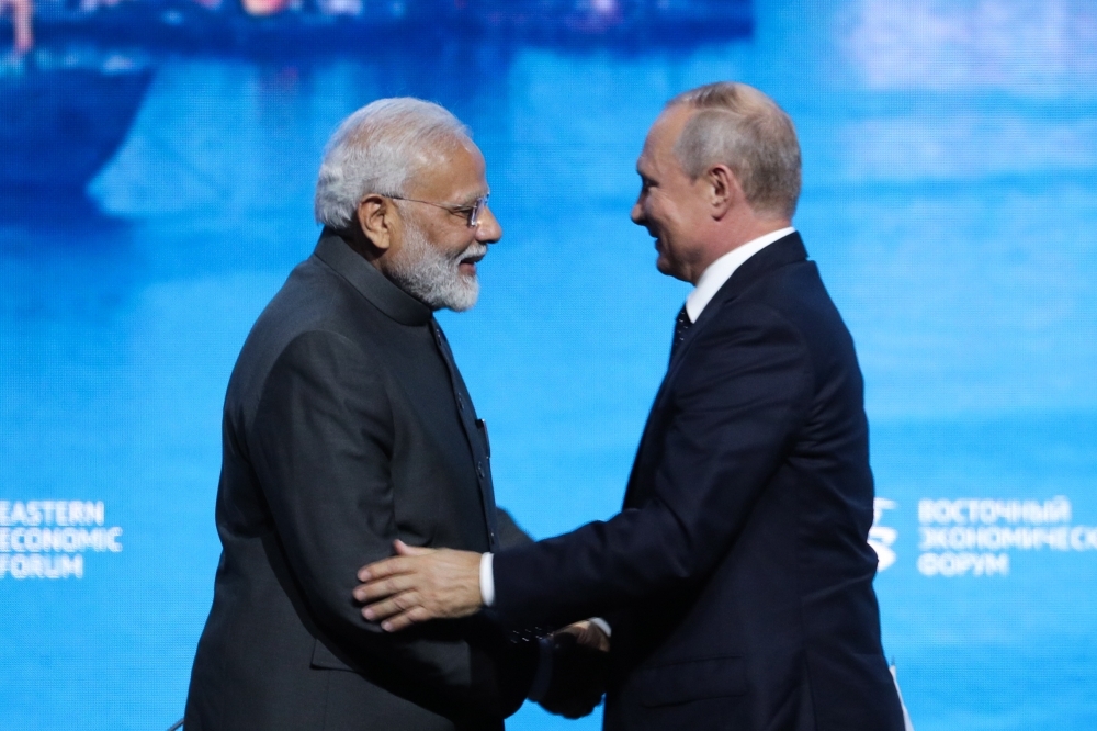 Indian Prime Minister Narendra Modi, left, shakes hands with Russian President Vladimir Putin at a plenary session of Eastern Economic Forum at far-eastern Russian port of Vladivostok on Thursday. — AFP