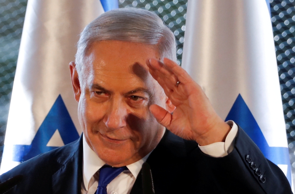 Israeli Prime Minister Benjamin Netanyahu gestures as he speaks during a state memorial ceremony in Hebron in the Israeli-occupied West Bank on Wednesday. — Reuters