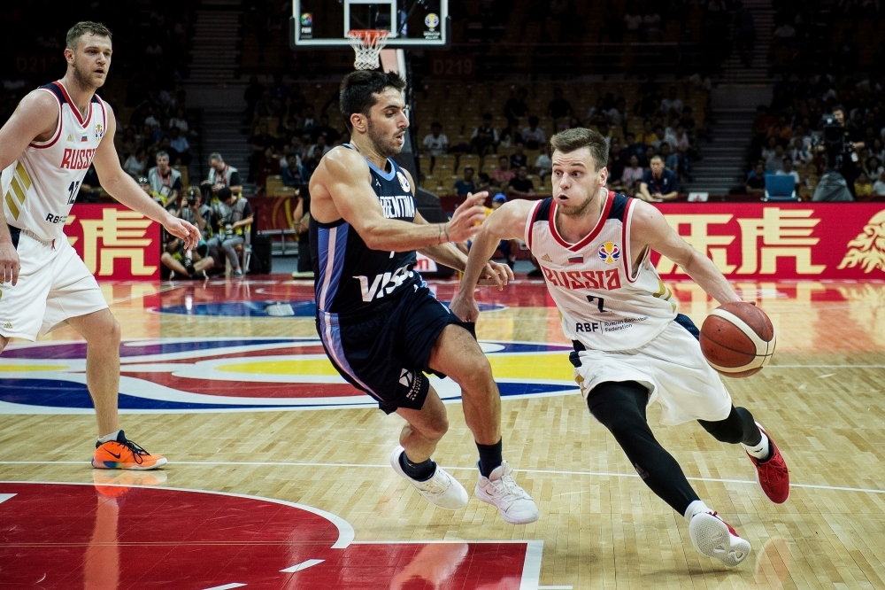 Spain's Javier Beiran (L) fights for the ball with Iran's Behnam Yakhchali (R) and Iran's Sajjad Mashayekhi during the Basketball World Cup Group C game between Spain and Iran in Guangzhou on Wednesday. — AFP