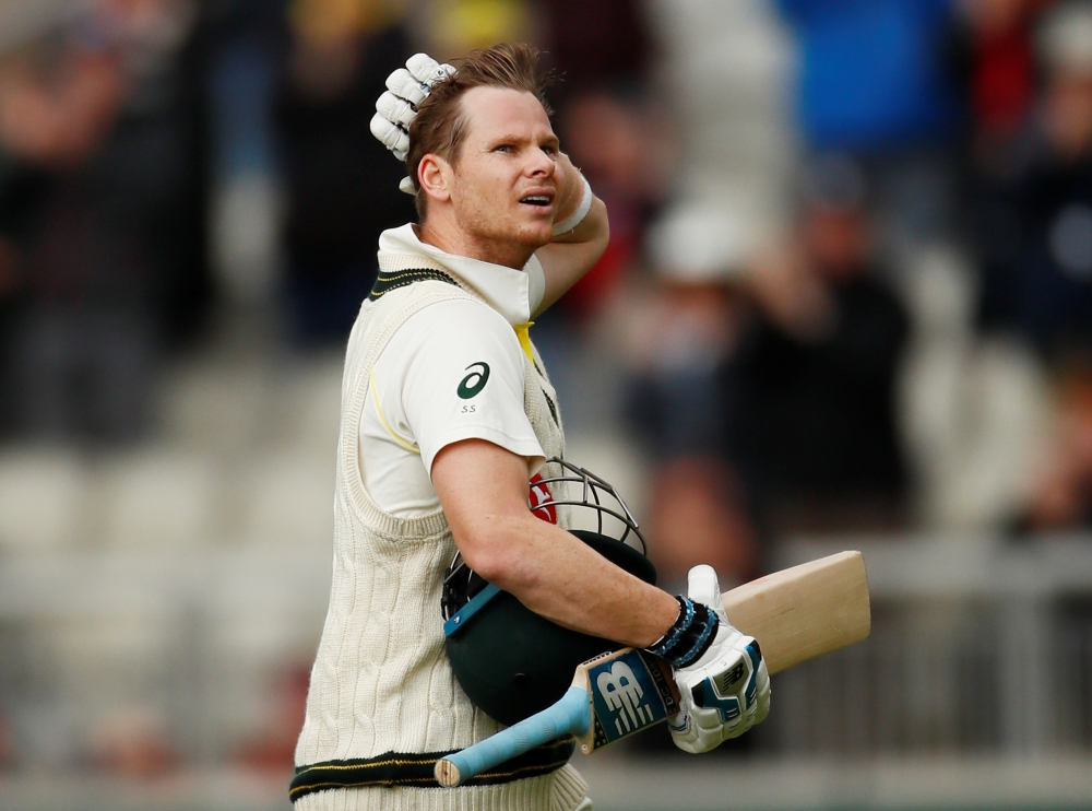 Australia's Steve Smith walks after losing his wicket during the fourth Ashes Test against England at the Emirates Old Trafford, Manchester, Britain, on Thursday. — Reuters