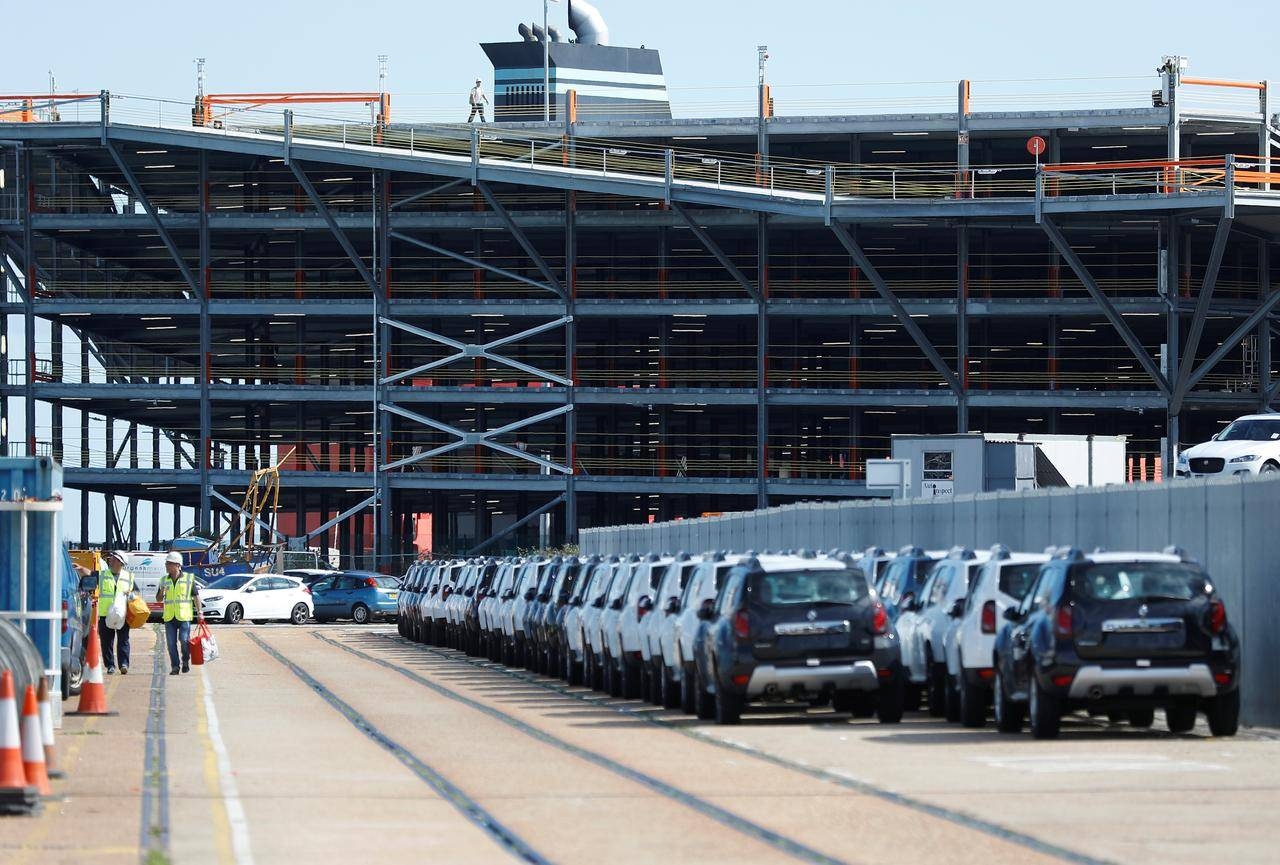 Cars readied for export are parked next to a vehicle storage facility on the dockside at the ABP port in Southampton, Britain in this Aug. 16, 2017, file photo. — Reuters
