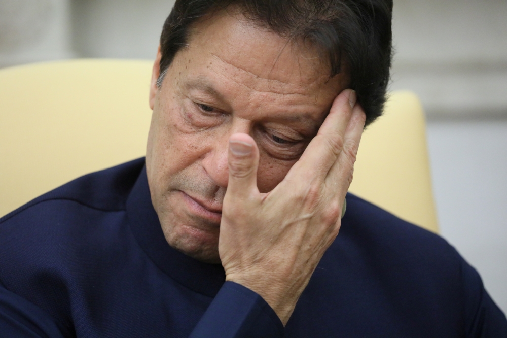 Pakistan’s Prime Minister Imran Khan listens while meeting with US President Donald Trump in the Oval Office at the White House in Washington in this July 22, 2019 file photo. — Reuters