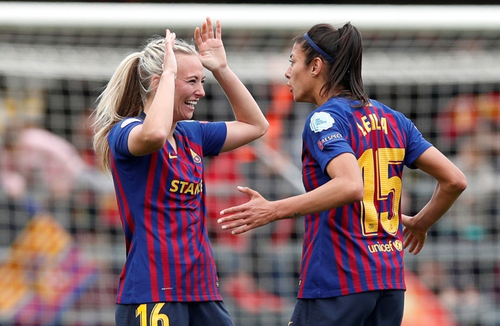 Barcelona's Toni Duggan and Leila Ouahabi celebrate after the Women's Champions League semifinal second leg match against Bayern Munich at Mini Estadi, Barcelona, Spain, on April 28, 2019. — Reuters