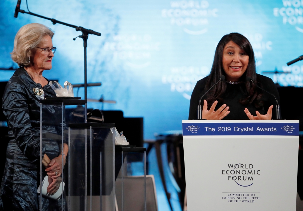 Saudi Arabian director Haifaa Al-Mansour delivers a speech next to Hilde Schwab, Chairperson and Co-Founder of Schwab Foundation for Social Entrepreneurship, as she receives a Crystal Award during an opening ceremony of the World Economic Forum (WEF) in Davos, Switzerland, in this Jan. 21, 2019 file photo. — Reuters