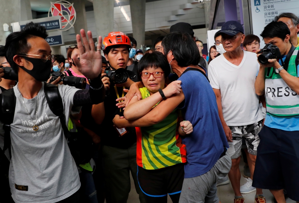 People attend a protest in Tung Chung station, in Hong Kong on Saturday. -Reuters