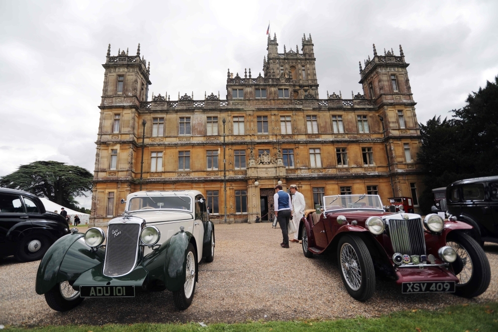 Visitors attend a 1920's themed event at Highclere Castle, near Newbury, west of London, on Saturday, ahead of the world premiere of the Downton Abbey film. -AFP