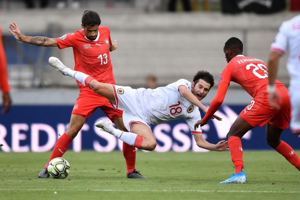 (From L) Switzerland's midfielder Edimilson Fernandes, Gilbraltar's midfielder Anthony Hernandez and Switzerland's midfielder Gelson Fernandes fight for the ball during the Euro 2020 qualifying football match between Switzerland and Gibraltar, at the Tourbillon stadium in Sion, on Sunday. — AFP