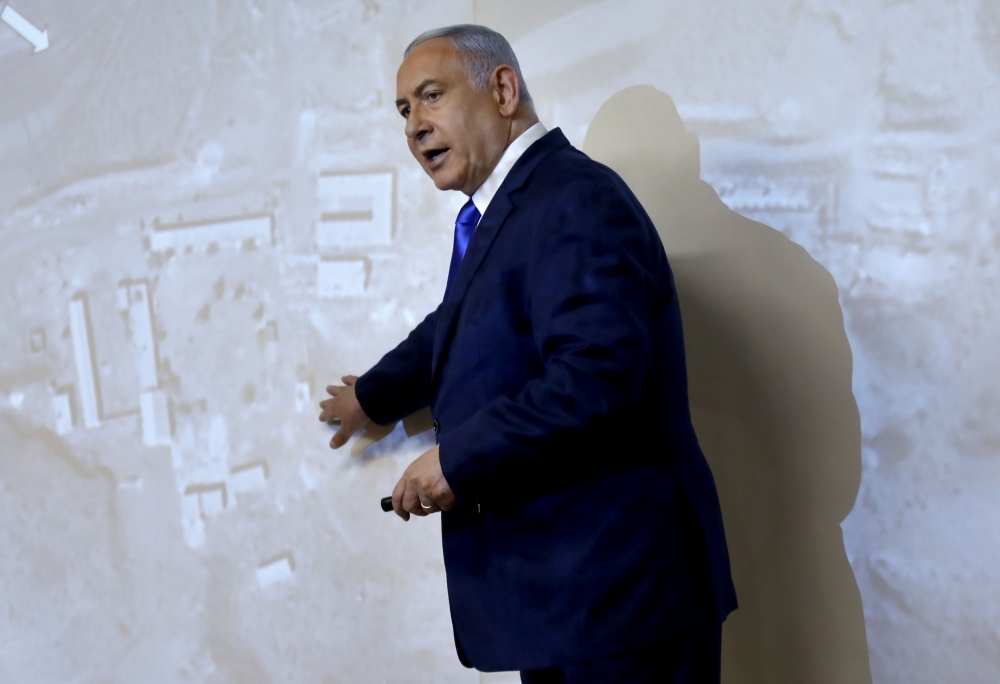 Israeli Prime Minister and Defense Minister Benjamin Netanyahu delivers a statement to the media on the Iranian nuclear issue at the Foreign Ministry in Jerusalem on Monday. — AFP