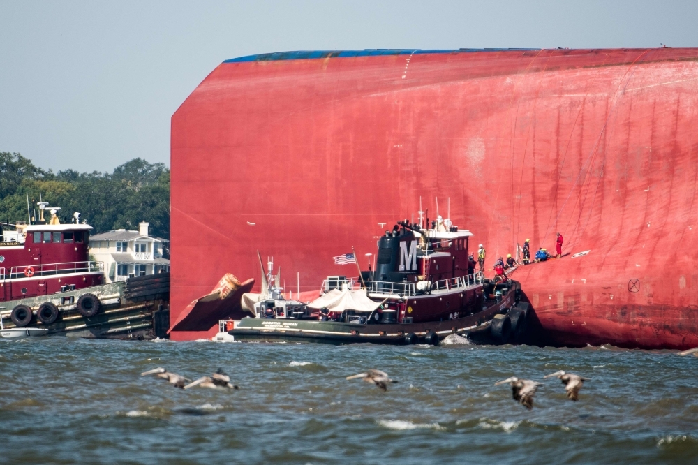 Emergency responders work to rescue crew members from a capsized cargo ship on Monday in St Simons Island, Georgia. -Courtesy photo