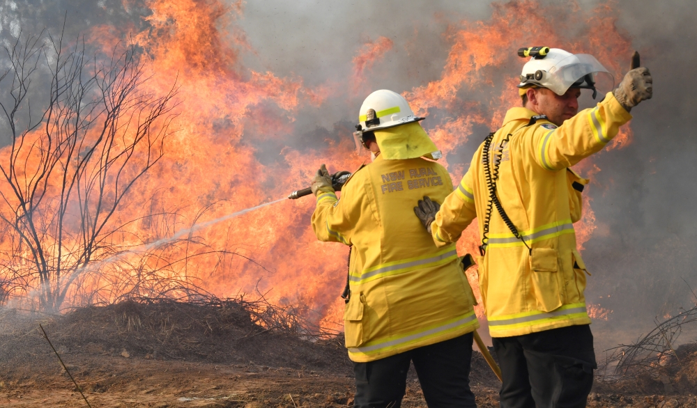 New South Wales Rural Fire Service firefighters are seen fighting fires on Long Gully Road in the northern New South Wales town of Drake, Australia on Monday. -Reuters