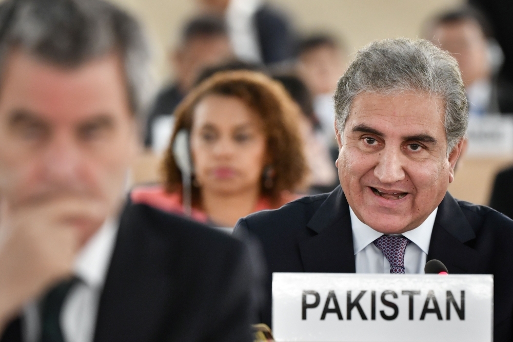 Pakistani Foreign Minister Shah Mehmood Qureshi, center, addresses the United Nations Human Rights Council in Geneva on Tuesday. — AFP