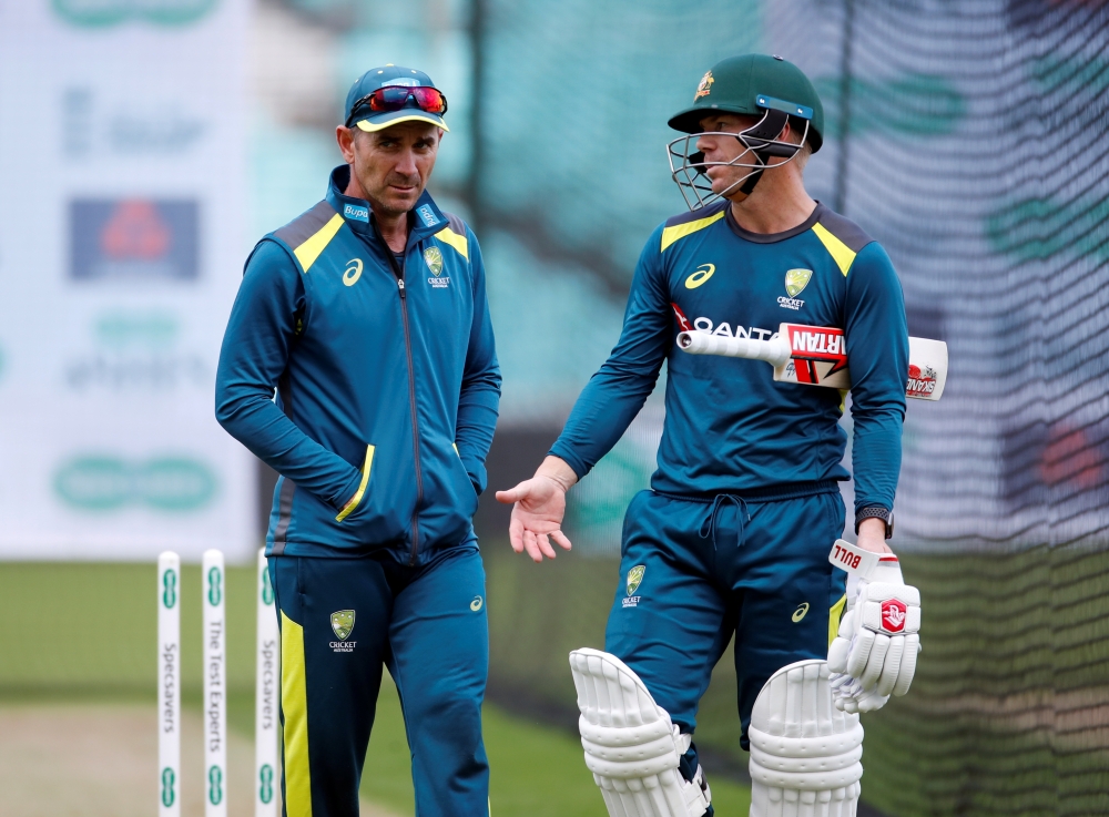 Australia coach Justin Langer and David Warner during nets at Kia Oval, London, on Tuesday. — Reuters