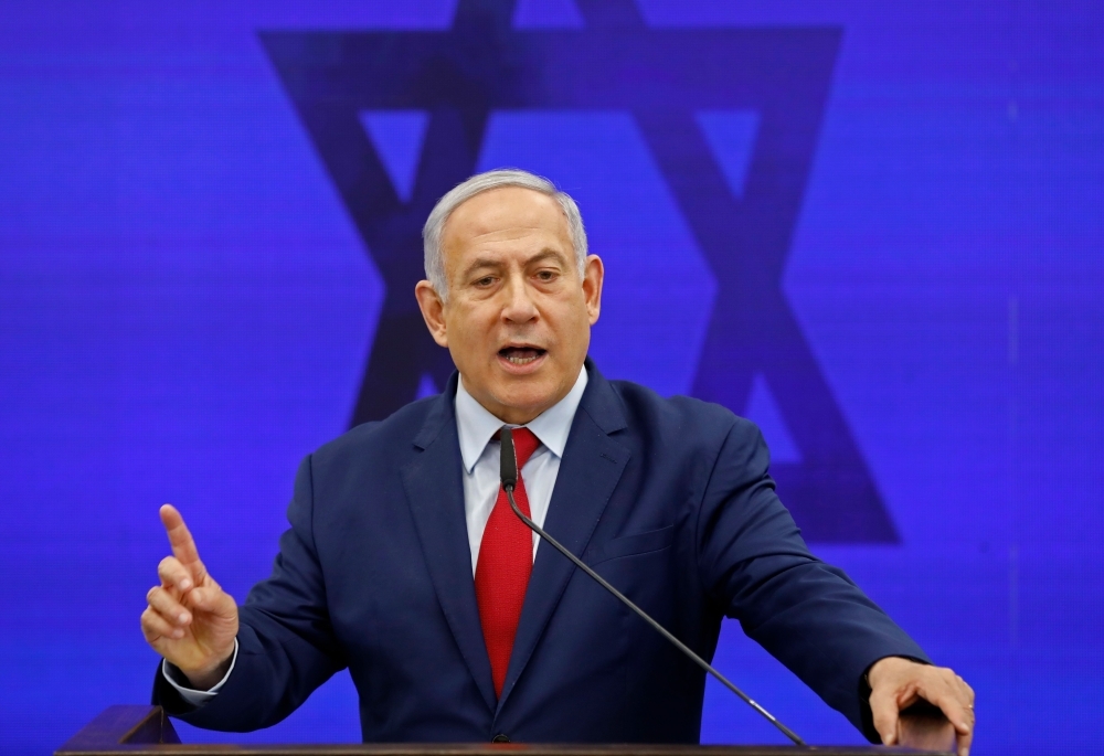 Israeli Prime Minister Benjamin Netanyahu gives a statement in Ramat Gan, near the Israeli coastal city of Tel Aviv, on Tuesday. — AFP