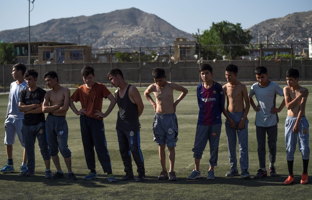 In this photo taken on June 13, 2019, young rugby players stand in line after a practice session on a pitch in Kabul. Essentially unheard of before the arrival of international forces, the sport of rugby has slowly begun to pick up steam in Afghanistan, where football, cricket and body-building are better known. — AFP