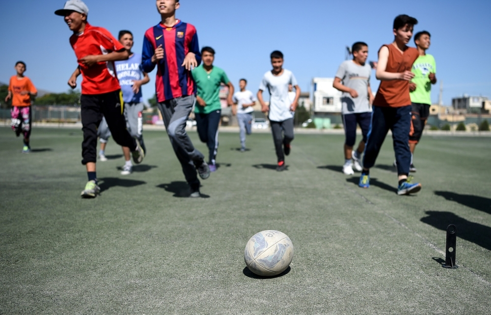 In this photo taken on June 13, 2019, young rugby players stand in line after a practice session on a pitch in Kabul. Essentially unheard of before the arrival of international forces, the sport of rugby has slowly begun to pick up steam in Afghanistan, where football, cricket and body-building are better known. — AFP