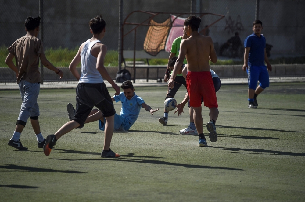 In this photo taken on June 13, 2019, young rugby players stand in line after a practice session on a pitch in Kabul. Essentially unheard of before the arrival of international forces, the sport of rugby has slowly begun to pick up steam in Afghanistan, where football, cricket and body-building are better known. — AFP