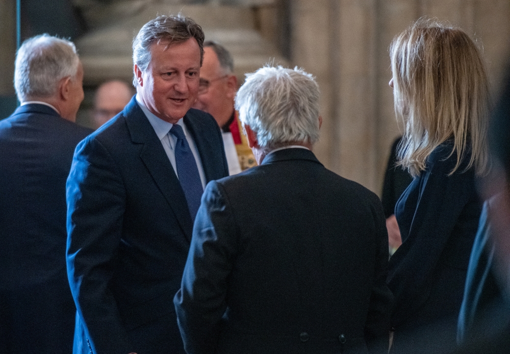 Britain's former Prime Minister David Cameron speaks with Speaker of the House of Commons, John Bercow during the memorial service for Lord Paddy Ashdown at Westminster Abbey, in London on September 10, 2019.  -Reuters