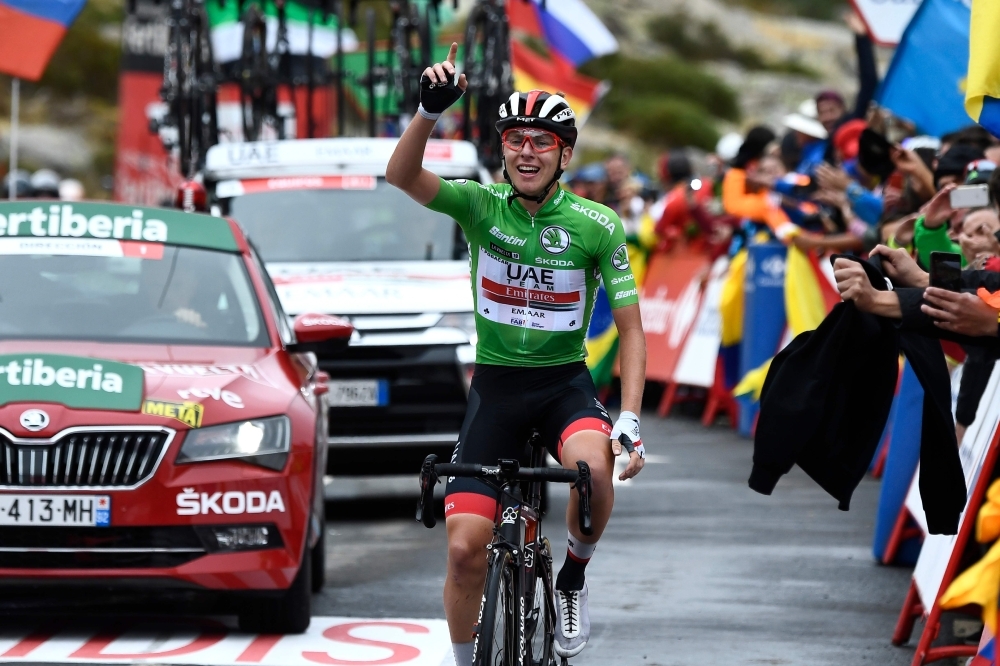 Team UAE Emirates rider Slovenia's Tadej Pogacar celebrates as he crosses the finish line of the 20th stage of the 2019 La Vuelta cycling Tour of Spain, a 190.4 km race from Arenas de San Pedro to Plataforma de Gredos, on Saturday. — AFP