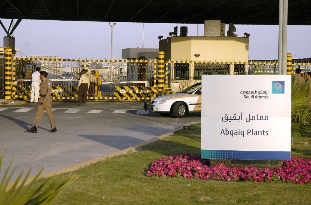 In this file photo taken on Feb. 25, 2006 Saudi security guard the entrance of the oil processing plant of the Saudi state oil giant Aramco in Abqaiq in the oil-rich Eastern Province. — AFP