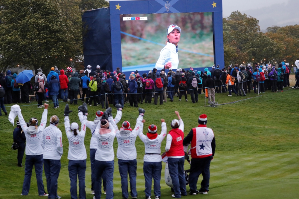 Team USA players watch their teammates on the big screen during the fourballs of the Solheim Cup at Gleneagles, Scotland, Britain, on Saturday. — Reuters