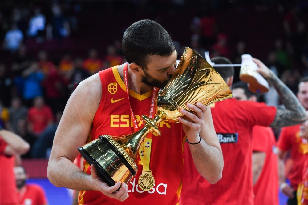 Spain's Marc Gasol celebrates with their winning trophy at the end of the Basketball World Cup final game between Argentina and Spain in Beijing, on Sunday. — AFP