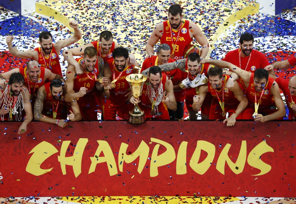 Spain's Marc Gasol celebrates with their winning trophy at the end of the Basketball World Cup final game between Argentina and Spain in Beijing, on Sunday. — AFP