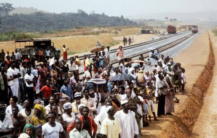 


In this file photo taken on January 18, 1983, Gabonese take part in the inauguration of second section Ndjolé-Boouéthe Trans-Gabon Railway (Transgabonais) in Gabon.  — AFP

