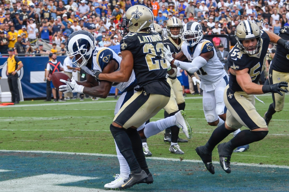 Los Angeles Rams wide receiver Brandin Cooks (12) grabs a touchdown pass in front of New Orleans Saints cornerback Marshon Lattimore (23) during the 3rd quarter at Los Angeles Memorial Coliseum, Los Angeles, on Sunday. — Reuters